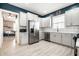Bright kitchen featuring stainless steel appliances, white cabinets, and ample counter space, perfect for cooking at 1205 N Oxford St, Indianapolis, IN 46201