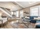 Spacious living room with plush seating, stylish glass table, and modern decor, perfect for entertaining at 1205 N Oxford St, Indianapolis, IN 46201