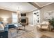 Inviting living room with fireplace, plush sofa, and stylish decor creating a warm, comfortable space at 1205 N Oxford St, Indianapolis, IN 46201