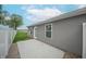 New home featuring an easy-to-maintain backyard with concrete patio and a white vinyl privacy fence at 1491 Coen Ct, Columbus, IN 47201