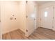 Open mud room featuring washer hookups and neutral color palette at 1491 Coen Ct, Columbus, IN 47201