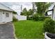 Wide open backyard with a grass lawn and a white fence at 1507 N Luett Ave, Indianapolis, IN 46222