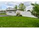 The home's detached garage is accented by decorative design and a fenced yard at 1507 N Luett Ave, Indianapolis, IN 46222