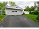 Detached single-car garage with a white door and an eagle decoration at 1507 N Luett Ave, Indianapolis, IN 46222