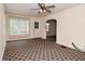Living room showcasing a large window, front door and entry to another room at 1507 N Luett Ave, Indianapolis, IN 46222