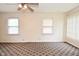 Spacious living room featuring neutral walls, large windows and a ceiling fan at 1507 N Luett Ave, Indianapolis, IN 46222