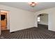 Open concept living room featuring neutral walls, carpet, and natural light at 1507 N Luett Ave, Indianapolis, IN 46222