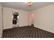 View of the living room showing entrances to the kitchen and hallways at 1507 N Luett Ave, Indianapolis, IN 46222