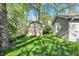 View of the backyard, showing the storage shed, lawn, and home's exterior at 1523 E Perry St, Indianapolis, IN 46227