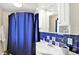 This bathroom features blue accents, creating a clean and refreshing atmosphere for relaxation and rejuvenation at 1523 E Perry St, Indianapolis, IN 46227