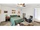 Comfortable bedroom with a queen bed, soft lighting, and a welcoming ambiance at 1523 E Perry St, Indianapolis, IN 46227