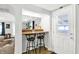 Charming breakfast bar featuring seating and an open layout to the living room at 1523 E Perry St, Indianapolis, IN 46227