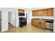 Functional kitchen featuring wood cabinets, stainless steel appliances, and a practical layout at 1523 E Perry St, Indianapolis, IN 46227