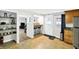 Bright eat-in kitchen with wood floors, and a breakfast bar offering views of the living room at 1523 E Perry St, Indianapolis, IN 46227