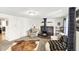 Living room with neutral carpet, white walls, and a brick fireplace at 1523 E Perry St, Indianapolis, IN 46227