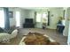Inviting living room with bright window, indoor plants and stylish accents at 1523 E Perry St, Indianapolis, IN 46227