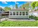 The sunroom offers lots of natural light with windows surrounding three sides of the room at 1523 E Perry St, Indianapolis, IN 46227