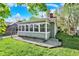 The sunroom offers lots of natural light with windows surrounding three sides of the room at 1523 E Perry St, Indianapolis, IN 46227