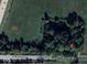 Aerial view of property featuring a treed lot on a rural road at 15490 W 700 S, Anderson, IN 46017