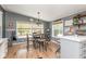 Comfortable eat-in kitchen with modern lighting, stylish decor, and a view of the outdoors at 1683 W County Road 300 S, Danville, IN 46122