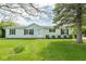Charming single-story home with a well-manicured front yard and mature trees enhancing its curb appeal at 1683 W County Road 300 S, Danville, IN 46122