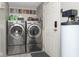 Laundry room with modern stainless steel washer and dryer set and stacked decor accents at 1683 W County Road 300 S, Danville, IN 46122