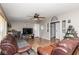 Inviting living room with wood flooring, a ceiling fan, and comfortable seating in a cozy setting at 1683 W County Road 300 S, Danville, IN 46122