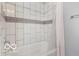 Modern bathroom with a stylish bathtub and white subway tile, showcasing clean lines and design at 1808 E 11Th St, Indianapolis, IN 46201