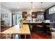 Open dining area with a wooden table that flows into a kitchen space at 1808 E 11Th St, Indianapolis, IN 46201