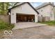 Spacious garage with open door view and concrete driveway, ready for your vehicle or storage needs at 1808 E 11Th St, Indianapolis, IN 46201