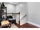 Cozy hallway nook with stylish decor, a comfortable chair, and classic wood banister at 1808 E 11Th St, Indianapolis, IN 46201