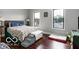 Main bedroom featuring hardwood floors, neutral paint, and natural light at 1808 E 11Th St, Indianapolis, IN 46201