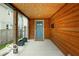Inviting porch area showcasing wood finishes and a stylish front door at 1808 E 11Th St, Indianapolis, IN 46201