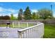 Wood deck with white railing in a fenced backyard at 1831 Brook Crossing Way, Indianapolis, IN 46229