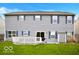 Backyard view with siding, deck, and a well-maintained lawn at 1831 Brook Crossing Way, Indianapolis, IN 46229