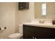 Bathroom features a modern vanity with dark wood cabinets and a white countertop at 1831 Brook Crossing Way, Indianapolis, IN 46229
