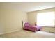 Light-filled bedroom with a small bed, carpeted floors, neutral-colored walls, and a single window at 1831 Brook Crossing Way, Indianapolis, IN 46229