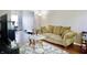 Inviting living room featuring hardwood floors, neutral walls, sofa, and large windows at 1831 Brook Crossing Way, Indianapolis, IN 46229