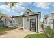 Back of the home with gray siding, large yard and new windows at 202 Mckim Ave, Indianapolis, IN 46201