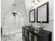 Bright bathroom featuring glass vessel sinks, modern fixtures, and marble tile in the shower and flooring at 202 Mckim Ave, Indianapolis, IN 46201