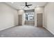 Spacious bedroom featuring a ceiling fan, neutral walls and carpet at 202 Mckim Ave, Indianapolis, IN 46201