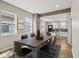 Dining area with wood table and views to the kitchen with white cabinets at 202 Mckim Ave, Indianapolis, IN 46201