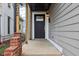 Close-up of the front entrance with black door and brick accents at 202 Mckim Ave, Indianapolis, IN 46201