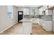 Modern kitchen featuring white cabinets, granite countertops, and a spacious center island at 202 Mckim Ave, Indianapolis, IN 46201