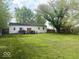 Spacious backyard with a large lawn, perfect for outdoor activities at 212 Vasbinder Dr, Chesterfield, IN 46017