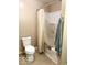 Neat bathroom featuring a toilet, shower with curtain, and towel rack in a clean design at 212 Vasbinder Dr, Chesterfield, IN 46017