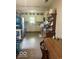 Open kitchen and dining area with wooden table and chairs, stainless appliances, and ample storage at 212 Vasbinder Dr, Chesterfield, IN 46017