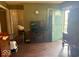 Open-concept living room showing hardwood floors, neutral walls and a green front door at 212 Vasbinder Dr, Chesterfield, IN 46017