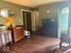 Living room featuring hardwood floors and neutral wall, and an open entryway at 212 Vasbinder Dr, Chesterfield, IN 46017