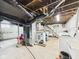 Spacious unfinished basement with exposed ceiling, concrete flooring, and laundry area ready for customization at 2314 Walnut St, Anderson, IN 46016